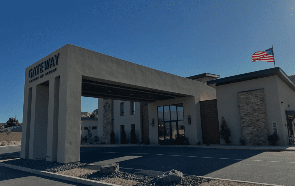 Modern RV resort entrance in Utah near national parks with contemporary architecture and American flag