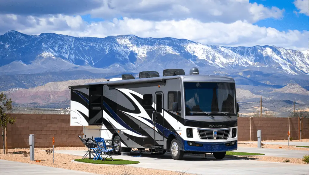 Luxury motorhome parked at an upscale RV resort near St. George, Utah, with stunning mountain views and premium camping amenities