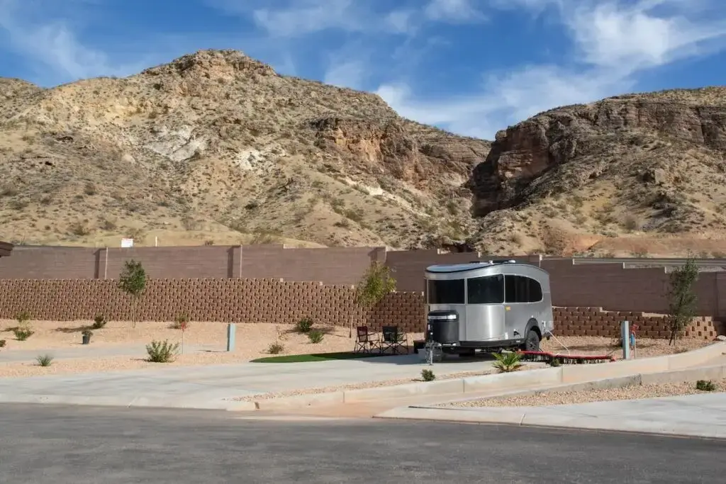 Affordable RV park near Zion National Park with trailer setup and scenic desert mountain views