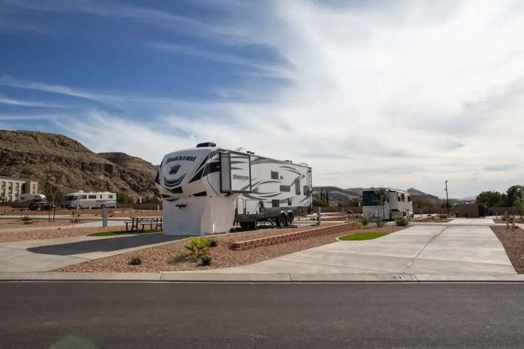 Fifth-wheel RV parked at a scenic campground in St George Utah with mountain views